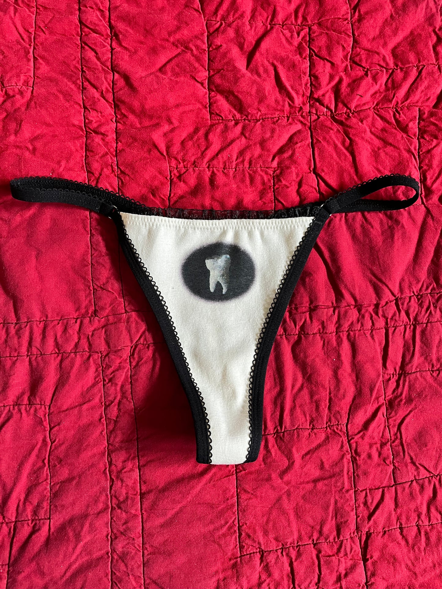 M TOOTH THONG